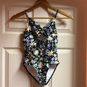 Abercrombie Kids: NWOT one piece floral bathing suit. Never worn. Size 9/10